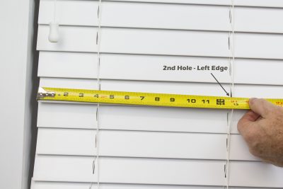 2. Measure from left (edge of slat) to the left edge of the second route hole to the nearest 1/16”. (write measurement down)