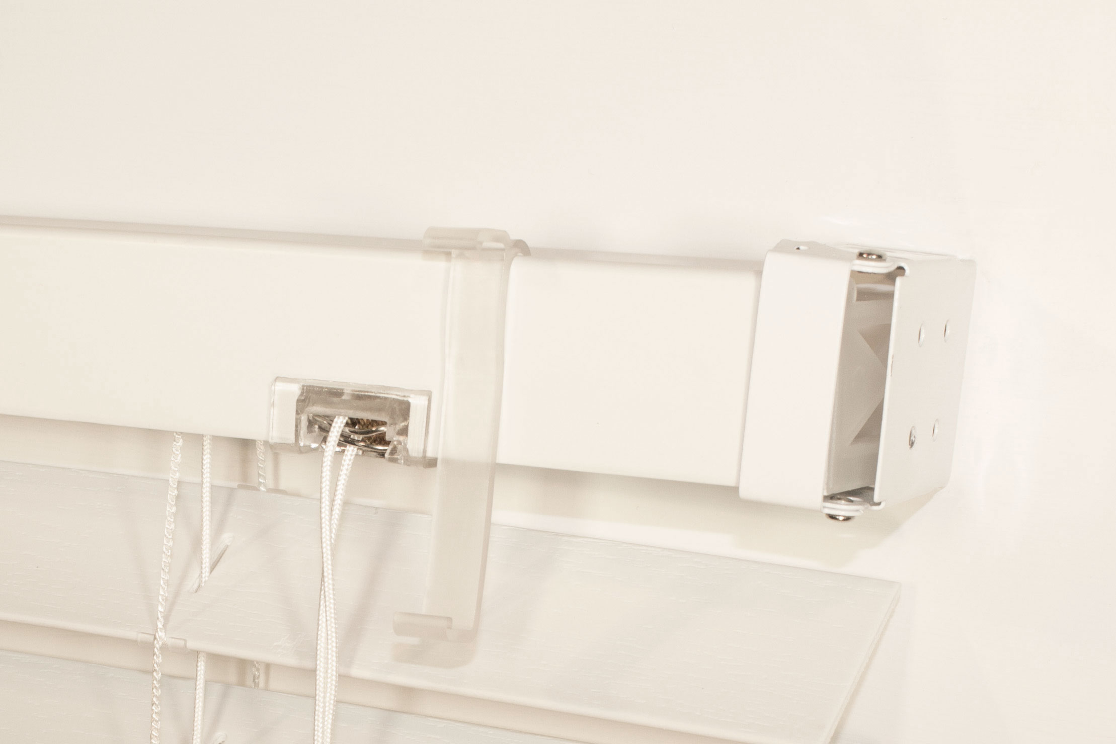 Mount (1) clip near each end, and (1) every 3’ intermittently. (if blind was removed - remount now)